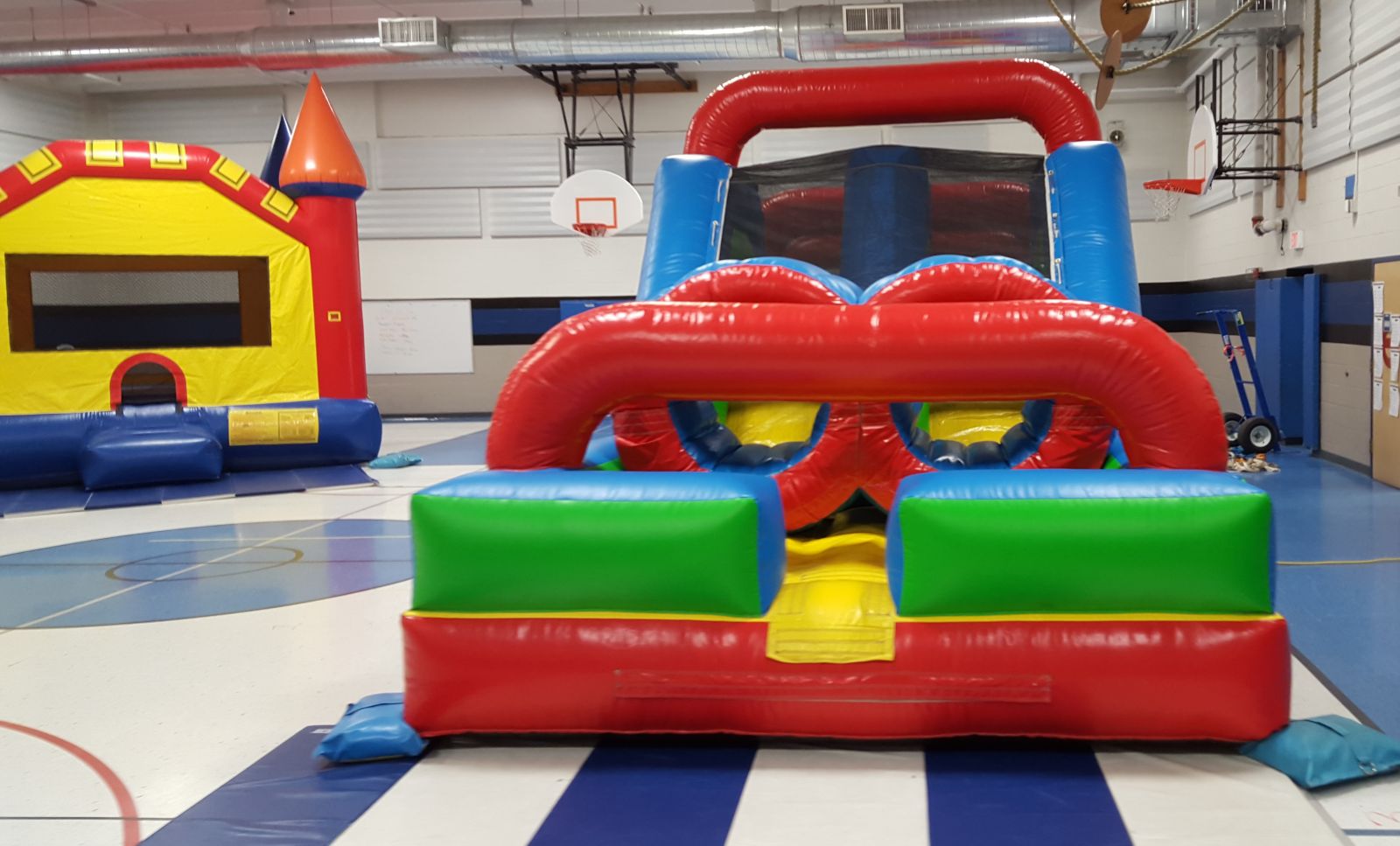 Obstacle Course and Bounce House in school gym
